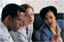 Picture of business people in conversation to illustrate our interpersonal communication skills training description page.