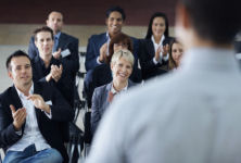Picture of an enthusiastic audience illustrating our sales presentation course description page.
