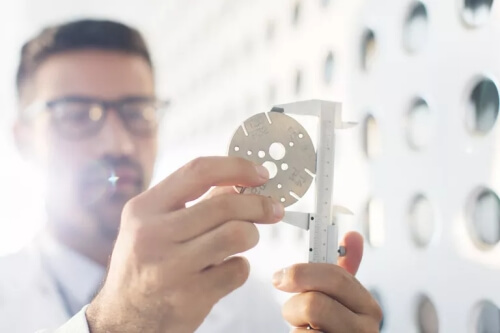 Picture of a scientists taking measurements to illustrate the value of sales and marketing assessments.