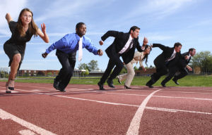 Piture of salespeople in a race to illustrate our Sales Coaching Return on Investment article.