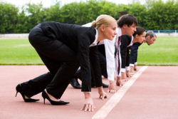 A picture of business people getting set for a race to support an article about sales career training