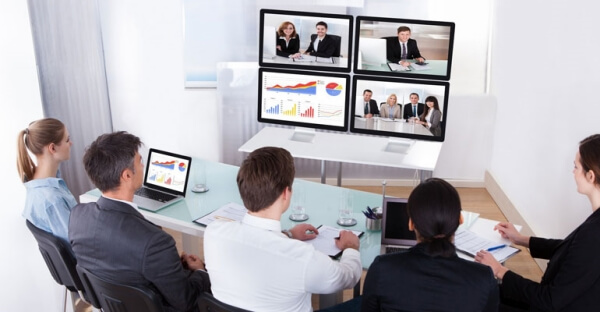 Image to illustrate people learning from online sales training or a webinar.